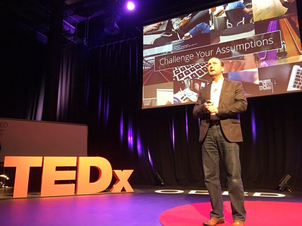 Chris on stage at Tedx